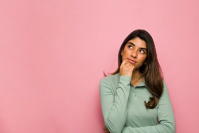 A woman with pink background